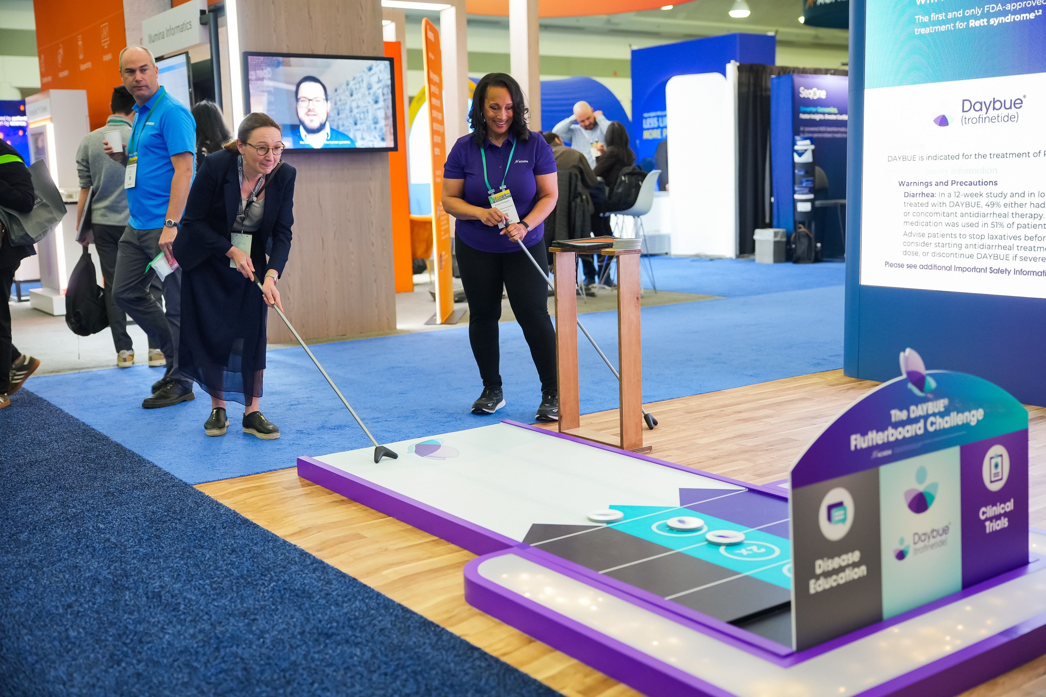 2026 exhibit hall, attendees plating cornhole